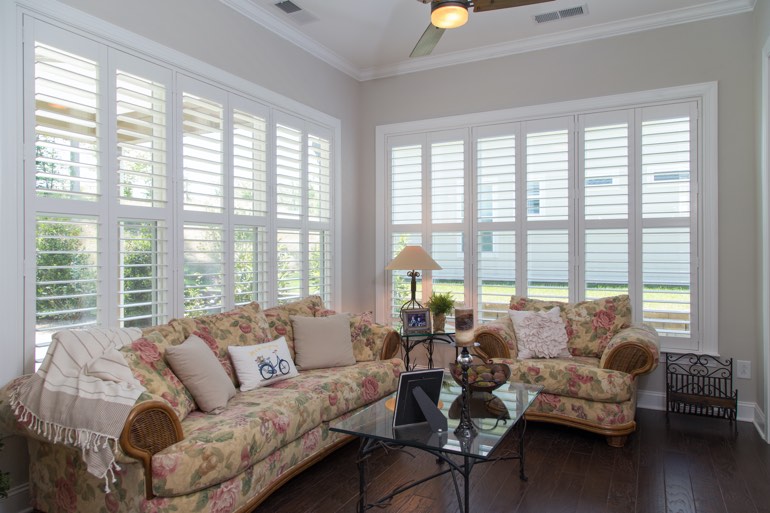 Airy sunroom with interior shutters in Chicago.